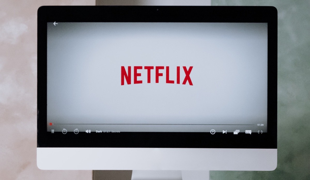 Netflix logo on an Apple monitor screen