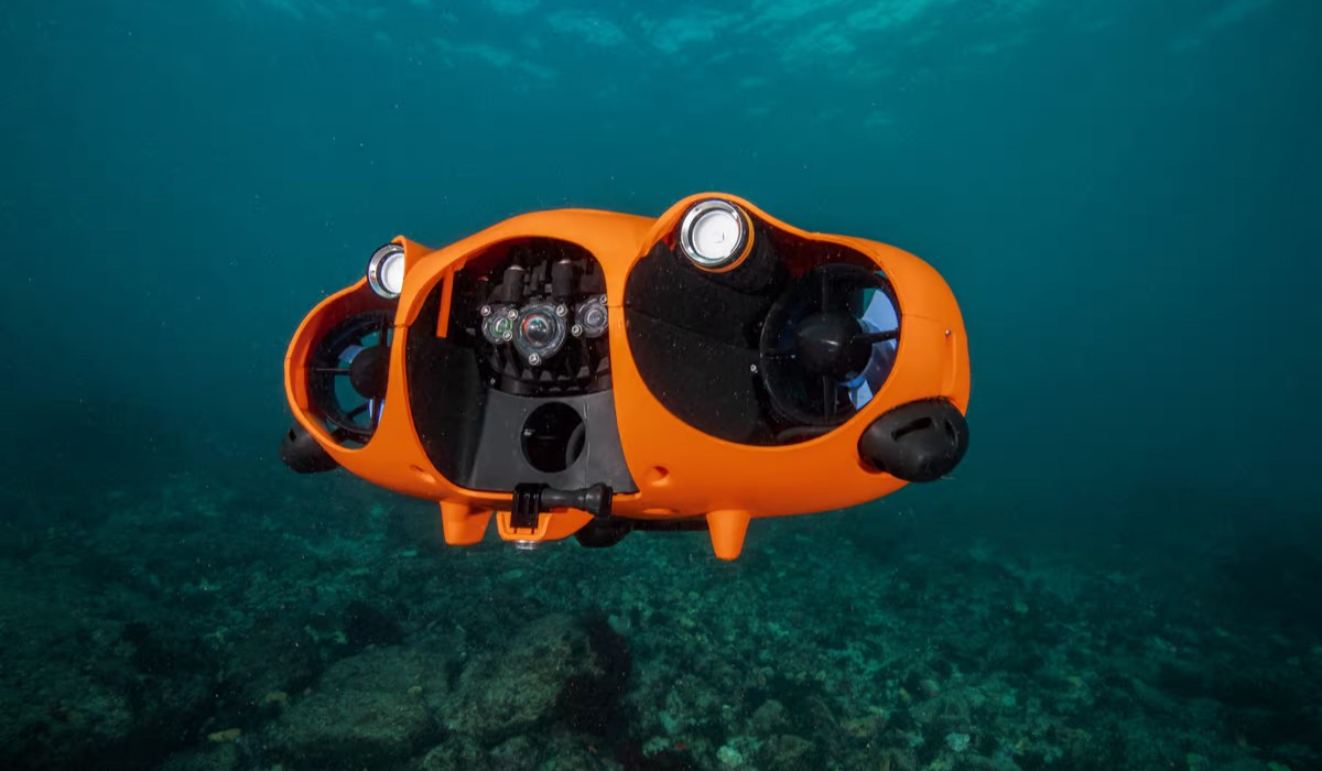 A drone under the water, close to the sea floor